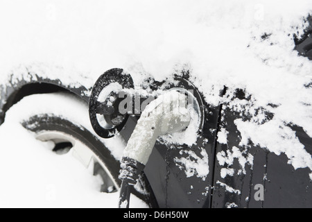 Snowy plug in electric car Stock Photo