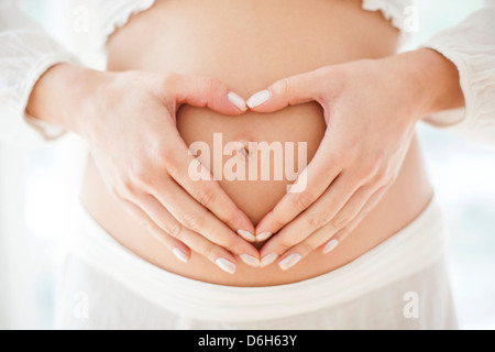 Pregnant woman's abdomen Stock Photo