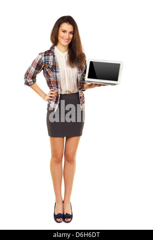 Young and attractive female holding a laptop and showing its blank screen Stock Photo