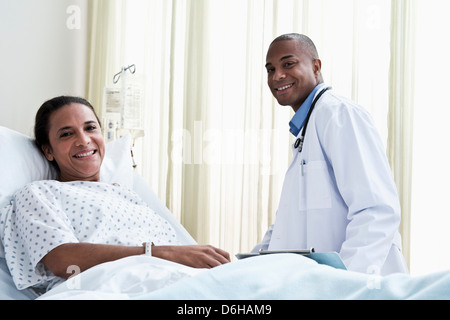 Male doctor and female patient in hospital Stock Photo