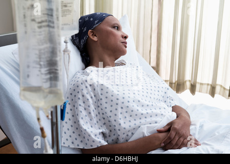 Female hospital patient in bed Stock Photo