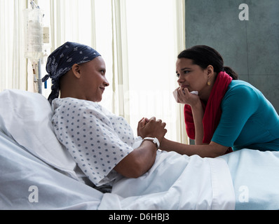 Daughter visiting mother in hospital Stock Photo