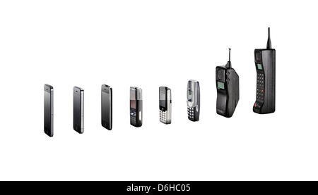 A range of mobile phones showing their evolution without shadows, shot as cutouts.