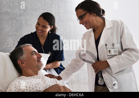 Doctor and nurse with patient Stock Photo