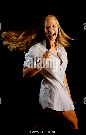 A young woman with a chocolate magnum ice cream Stock Photo