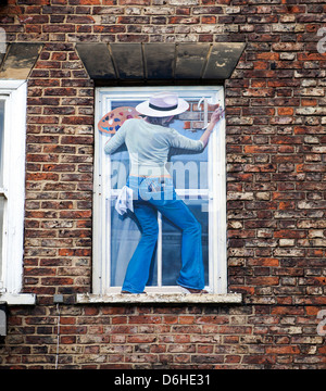 painting on the facade of a building where a window was bricked up to avoid the window tax of 1696-1851 Stock Photo