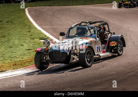 Caterham Seven sports car racing at Cadwell park race track. Stock Photo