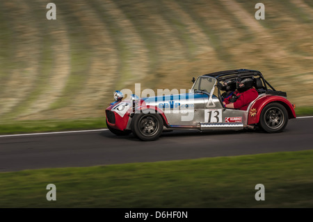 Side view of a Caterham car racing at Cadwell park racetrack, on sunny day. Stock Photo