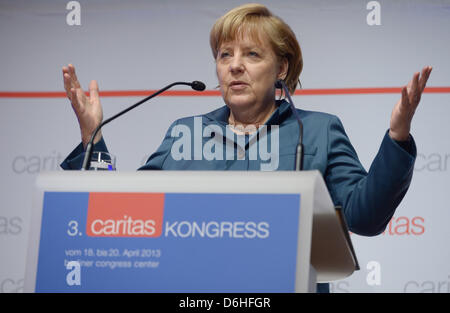 Berlin, Germany. 18th April, 2013. German Chancellor Angela Merkel talks during the annual reception of the German Caritas Association in Berlin, Germany, 18 April 2013. Photo: RAINER JENSEN/dpa/Alamy Live News Stock Photo