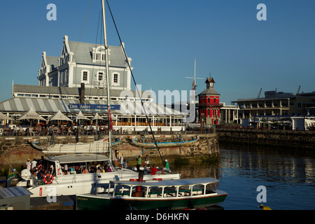 Tour boats, restaurant, and Old Port Captain's Building (1904), Victoria and Alfred Waterfront, Cape Town, South Africa Stock Photo