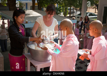 Nuns queuing for a meal, Sakyadhita Thilashin Nunnery School, Sagaing, near Mandalay, Myanmar, (Burma) Stock Photo