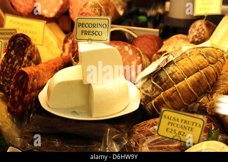A selection of salami and cheese on display in San Lorenzo market in Florence Italy Stock Photo