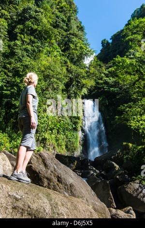 Tourist looking at the Trafalgar Falls, Morne Trois Pitons National Park, UNESCO Site, Dominica, West Indies, Caribbean Stock Photo