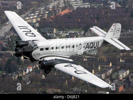 FILE - An archive picture dated 06 April 2006 shows a Junkers Ju 52 in flight over Hamburg, Germany. On 07 March 1932 aviation history was written when a three-engine 'Tante (Aunty) Ju' took flight for the first time. Photo: Maurizio Gambarini Stock Photo