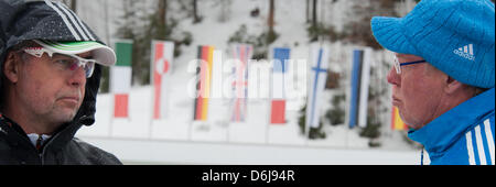 Head coach of the German team Uwe Muessiggang (L) talks to the Russian women's coach, the Austrian Wolfgang Pichler during the women's training session of the biathlon world championships at the Chiemgau Arena in Ruhpolding, Germany, 08 March 2012. Photo: PETER KNEFFEL Stock Photo