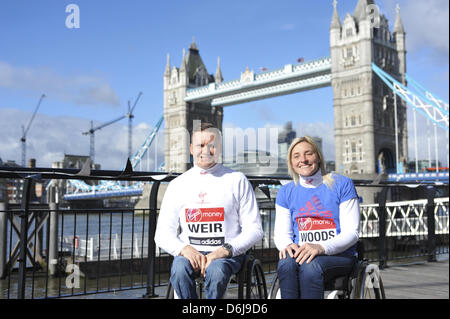 London, UK. 19th April 2013. David Weir & Shelly Woods at a photocall in front of Tower Bridge. Just seven months after winning four gold medals at the 2012 Paralympic Games, David Weir will return to London's streets on Sunday 21 April hoping to win his seventh London Marathon Wheelchair title. Shelly will be chasing her third London Marathon title when she defends her crown against a world class field after taking a silver medal in the 2012 Paralympic Games marathon in September. Credit: Michael Preston/Alamy Live News Stock Photo