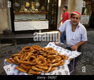 Food seller selling Simit Turkish bagel, Grand Bazaar (Great Bazaar) (Kapali Carsi), Istanbul, Turkey, Europe, Eurasia Stock Photo
