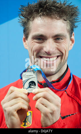 Bjoern Otto of Germany presents his silver medal during the victory ceremony of the Men's pole vault final at the World Athletics Indoor Championships at Atakoy Athletics Arena in Istanbul, Turkey, 11 March 2012. Photo: Bernd Thissen Stock Photo