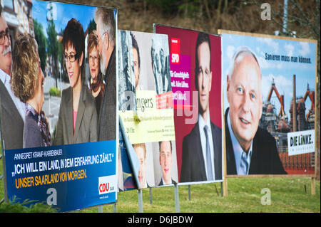 Different election posters campaigning for the Saarland state elections are seen in Blieskasel, Germany, 10 March 2012.  Saarland will elect its new state parliament on 25 March 2012 after the  CDU-FDP-Greens coalition, the so-called Jamaica coalition, split up. Photo: OLIVER DIETZE Stock Photo