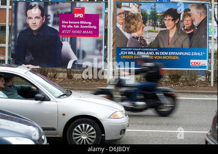 Election posters campaigning for the Saarland state elections show the top candidates Heiko Maas (Social Democrats SPD, L) and Annegret Kramp-Karrenbauer (Christian Democrats CDU) in Blieskasel, Germany, 10 March 2012.  Saarland will elect its new state parliament on 25 March 2012 after the  CDU-FDP-Greens coalition, the so-called Jamaica coalition, split up. Photo: OLIVER DIETZE Stock Photo