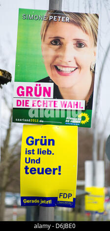 Election posters of the Greens (TOP) and the Free Liberals campaigning for the Saarland state elections are seen in  St. Ingbert, Germany, 10 March 2012.  Saarland will elect its new state parliament on 25 March 2012 after the  CDU-FDP-Greens coalition, the so-called Jamaica coalition, split up. Photo: OLIVER DIETZE Stock Photo