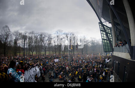 The teams of Dynamo Dresden (R) present themselves to their fans on a balcony after the 2nd Bundesliga match SG Dynamo Dresden vs FC Ingolstadt at Gluecksgas-Stadium in Dresden, Germany, 11 March 2012. The German Football Association (DFB) punished Dynamo Dresden with a ghost game and a 100,000 euro money fine, after several riots initiated by fans occured after soccer games. Photo Stock Photo