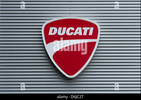 A Ducati emblem is seen at a motorcycle retailer in Regensburg, Germany, 13 March 2012. German car manufacturer Audi is interested in motorcycle manufacturer Ducati. Negotiations regarding the purchase are underway. Photo:  Armin Weigel Stock Photo