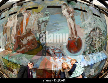 Painter Sighard Gille stands with his daughter Maja and granddaughter at his ceiling painting 'Gesang vom Leben' in Gewandhaus in Leipzig, Germany, 25 February 2012. The painting was created on the sloping ceiling of the foyer between 1980 and 1981 and is 714 square meters large and 31.80 meters high. The restoration of water damage to the painting caused renovations to the roof in Stock Photo