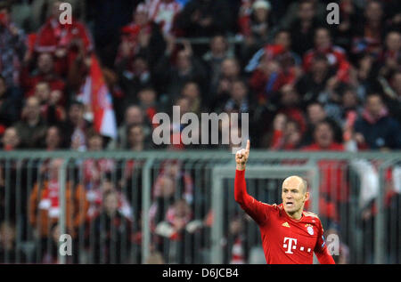 Bayern's Arjen Robben celebrates after scoring the 1-0 during the Champions League round of 16 second leg soccer match between FC Bayern Munich and FC Basel at Allianz Arena in Munich, Germany, 13 March 2012. Photo: Andreas Gebert dpa/lby  +++(c) dpa - Bildfunk+++ Stock Photo