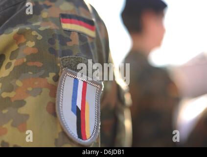 An badge of the German-French Brigade is pictured on the uniform of a German soldier of the Jaegerbataillon 292 during the return roll call at Fuerstenberg barracks in Donaueschingen, Germany, 15 March 2012. The 500 soldiers had been deployed to the German military camps Masar-i-Sharif and Kundus in the North of Afghanistan as part of the International Security Assistance Force (IS Stock Photo