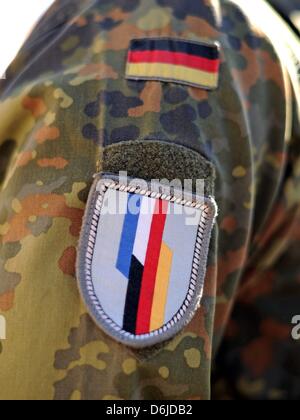 An badge of the German-French Brigade is pictured on the uniform of a German soldier of the Jaegerbataillon 292 during the return roll call at Fuerstenberg barracks in Donaueschingen, Germany, 15 March 2012. The 500 soldiers had been deployed to the German military camps Masar-i-Sharif and Kundus in the North of Afghanistan as part of the International Security Assistance Force (IS Stock Photo