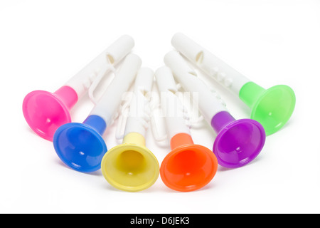 Children horn made of colored plastic isolated on white background. Stock Photo