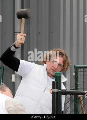 Dutch Prince Bernhard attends the Day of volunteering NL Doet at the foundation Assistance dog in Molenschot, 16 March 2012. The foundation is training dogs in specific skills to help people with mobility impairments. The royals helped by cleaning the kennels and office, created a puppy swing and bridge and played with the dogs. NL Doet is a National Volunteer day organized by the  Stock Photo