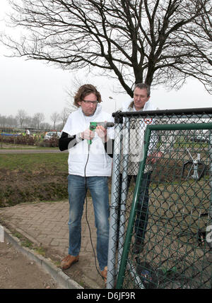 Dutch Prince Bernhard (L) attends the Day of volunteering NL Doet at the foundation Assistance dog in Molenschot, 16 March 2012. The foundation is training dogs in specific skills to help people with mobility impairments. The royals helped by cleaning the kennels and office, created a puppy swing and bridge and played with the dogs. NL Doet is a National Volunteer day organized by  Stock Photo