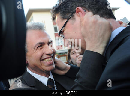 SPD candidate Peter Feldmann (L) makes fun with SPD state chairman  Thorsten Schaefer-Guembel after winning the mayor elections in Frankfurt am Main, Germany, 25 March 2012. Feldmann was elected the new mayor of Frankfurt. Photo: ANDREAS ARNOLD Stock Photo