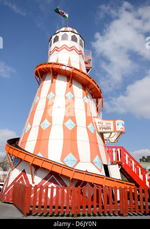 a fun helter skelter at a fairground on a sunny day Stock Photo