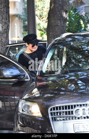 Laeticia Hallyday dressed causally and wearing a black hat as she gets into a car in Paris Paris, France - 23.09.11 Stock Photo
