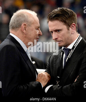 Boxing promoter Wilfried Sauerland (L) and his son Kalle Sauerland talk after the fight for the super middleweight WBO European Championship title between German boxer Abraham and Polish boxer Wilczewski at the Sparkassen Arena in Kiel, Germany, 01 April 2012. Photo: Christian Charisius Stock Photo