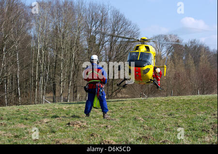 Rescue forces aboard helicopter 'Christoph 62' during a joint mountain rescue service manoeuvre of German automobile club ADAC and German Red Cross DRK division Saxony in Weissig, Germany, 23 March 2012. Photo: Arno Burgi Stock Photo