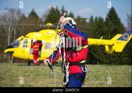 Rescue forces aboard helicopter 'Christoph 62' during a joint mountain rescue service manoeuvre of German automobile club ADAC and German Red Cross DRK division Saxony in Weissig, Germany, 23 March 2012. Photo: Arno Burgi Stock Photo