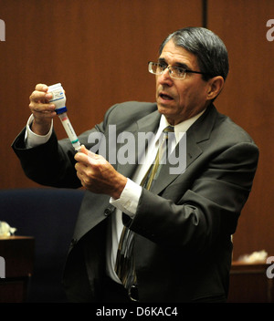 Dr. Paul White an anesthesiologist and propofol expert, demonstrates how propofol is loaded into a syringe during the final Stock Photo