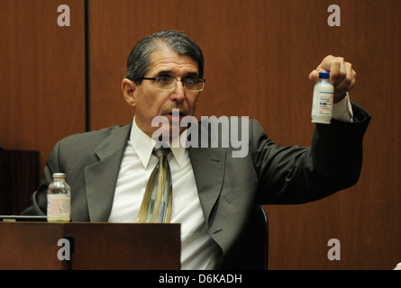 Dr. Paul White an anesthesiologist and propofol expert, holds a bottle of propofol during the final stage of Dr. Conrad Stock Photo