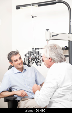 Optometrist doing Sight Testing Stock Photo