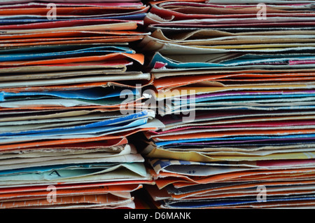 Stacks of vintage vinyl record singles in their original sleeves, can be used as a background Stock Photo