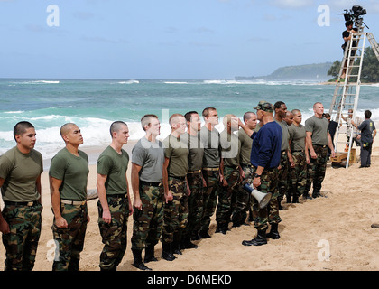Actors Alex O'Loughlin, Alan Ritchson and Terry O'Quinn along with sailors from Joint Base Pearl Harbor-Hickam simulate Navy SEALS training during filming of the television series CBS's Hawaii Five-0 March 1, 2013 in Haleiwa, Hawaii. Stock Photo