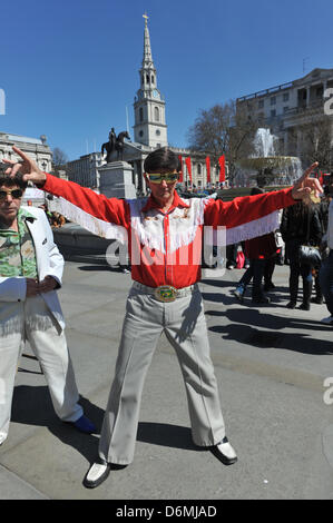 Trafalgar Square, London, UK. 20th April 2013. Two men dressed as Elvis at the Feast of St George. The Feast of St George in Trafalgar Square to celebrate food glorious food. The Mayor of London is inviting Londoners and visitors to a Feast of St George, a celebration of English food, including an English Food Market, a 5 metre Dragon, Jugglers, Jesters and Minstrels to entertain the crowd. Credit: Matthew Chattle/Alamy Live News Stock Photo