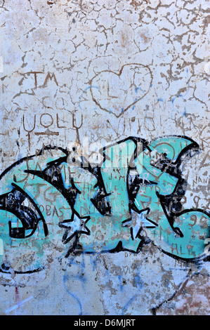 Graffiti on a stone wall. Stock Photo