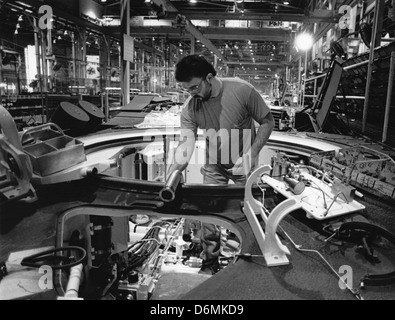 A General Dynamics employee works on the assembly of the hull of an Abrams M1A1 tank for the U.S. Army. Stock Photo