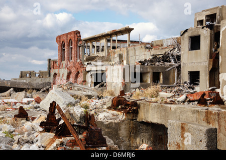 Ruins on the abandoned island of Gunkanjima off the coast of Nagasaki Prefecture, Japan. Stock Photo