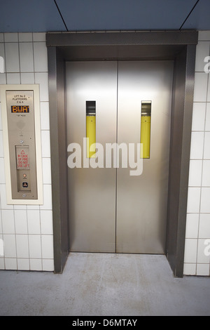 Closed passenger lift doors at Rugby Rail Station Warwickshire UK Stock Photo